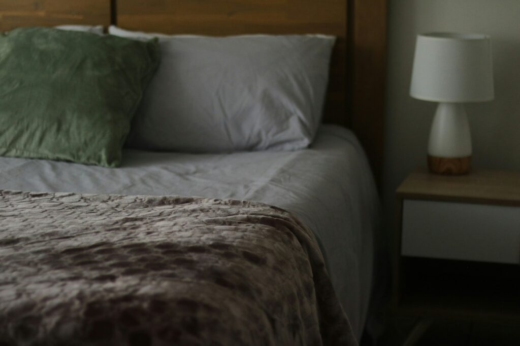 How to Keep Your House Warm This Winter Without Cranking the Heat 10 Cozy bed layered with warm blankets for winter